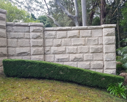 After - sandstone wall softwashing pressurewashing